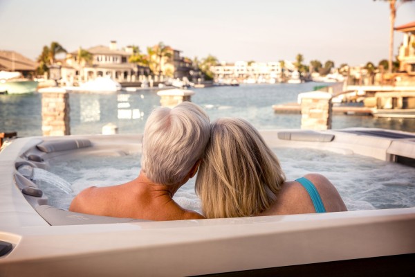 Grandparents enjoying their clean Sundance Spas hot tub.