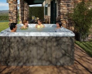 Family playing hot tub games in their Sundance Spa.