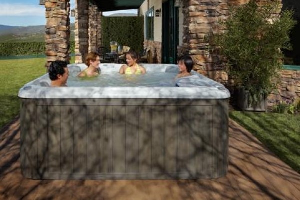 Family playing hot tub games in their Sundance Spa.