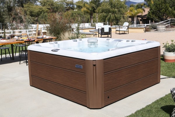 Outdoor hot tub installation on a concrete slab.
