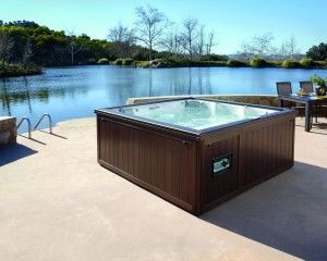Outdoor hot tub installation by the water.