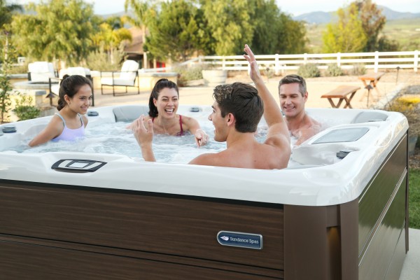 Family enjoying a Sundance Spas hot tub. Family enjoying a Sundance Spas hot tub.