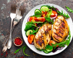 Healthy meal of chicken and salad.