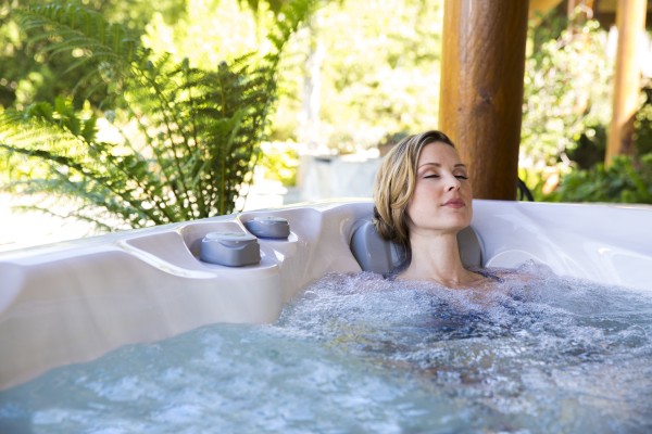 Woman relaxing in a hot tub.